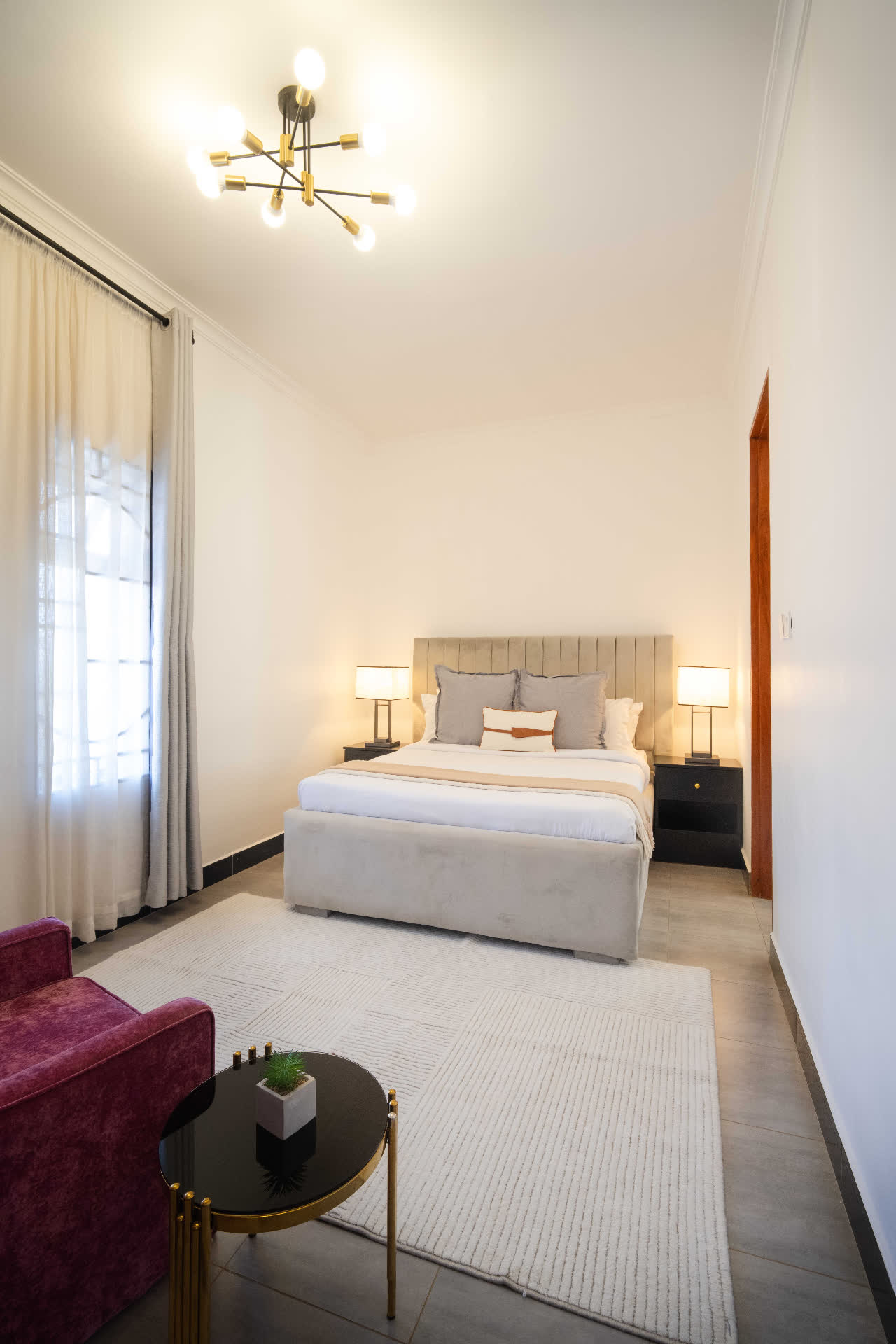 Blue Sapphire apartment bedroom wide view with seating area