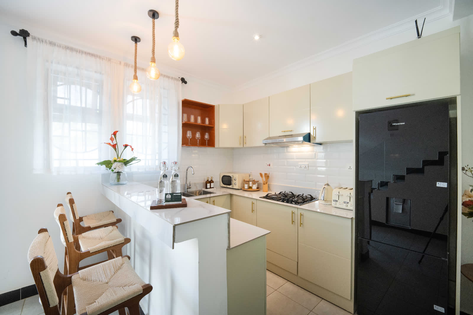 Ruby apartment kitchen with breakfast stools