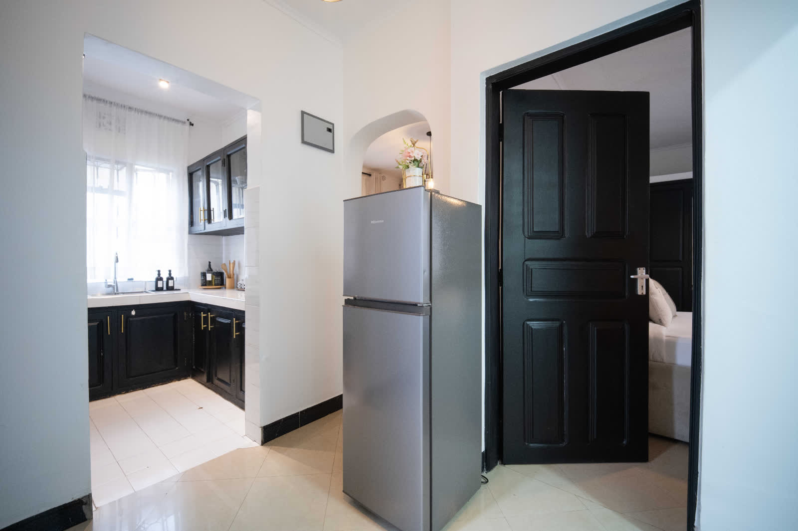 Tanzanite apartment entryway looking into kitchen and bedroom